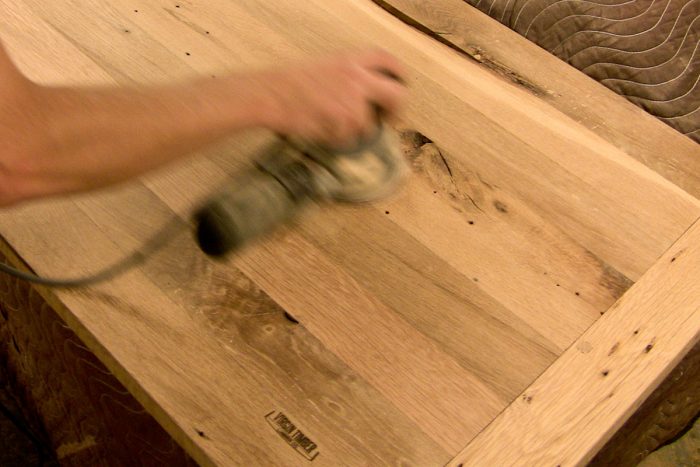 Virgin Timber sanding reclaimed wood
