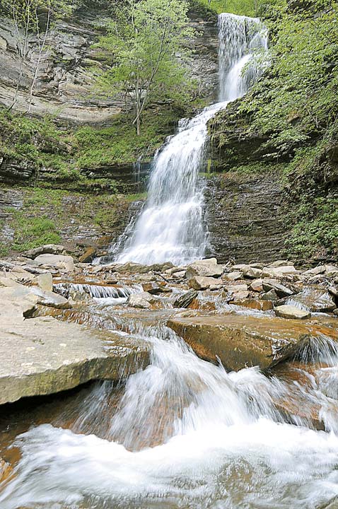 Leann Arthur/The Register-Herald Cathedral Falls, located near Gauley Bridge, was raging on Wednesday as a result of the area's recent rainfall. Cathedral Falls drops over 100 feet and is a tributary to the New River.