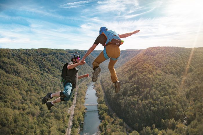 Professional BASE jumpers jumping from the New River Gorge Bridge at Bridge Day