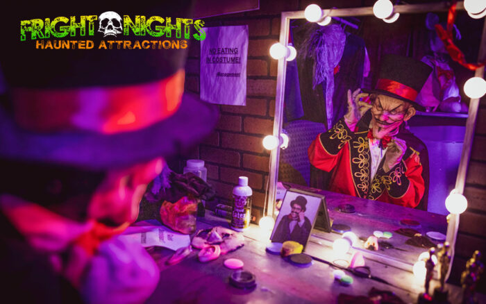 Fright Nights performer looking at themself in a mirror