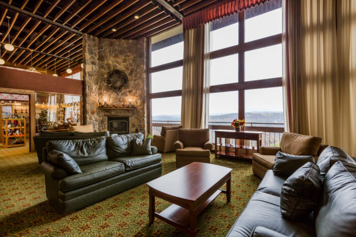 Fluffy couches and chairs in a lounge at Pipestem Resort State Park 