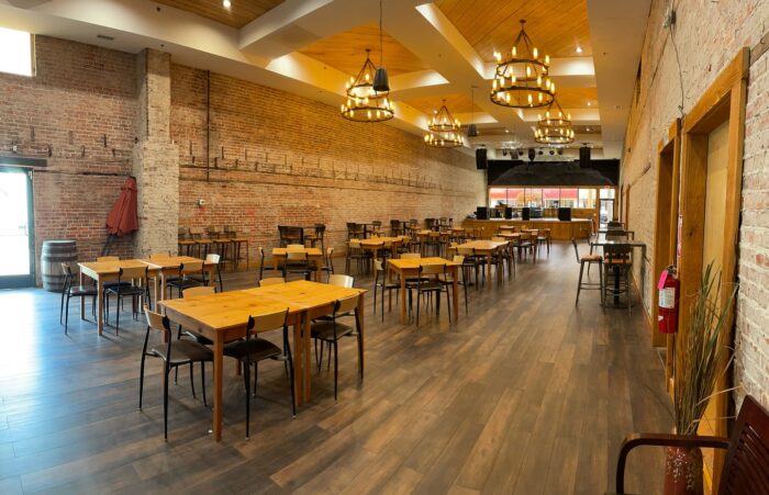 Inside restaurant showing empty table and chairs of Old School Brewing