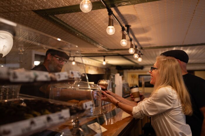 Person ordering coffee at Otter Cafe
