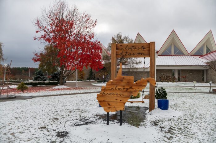 Fall and snow collide in this view of Tamarack Marketplace and the Almost Heaven WV swing