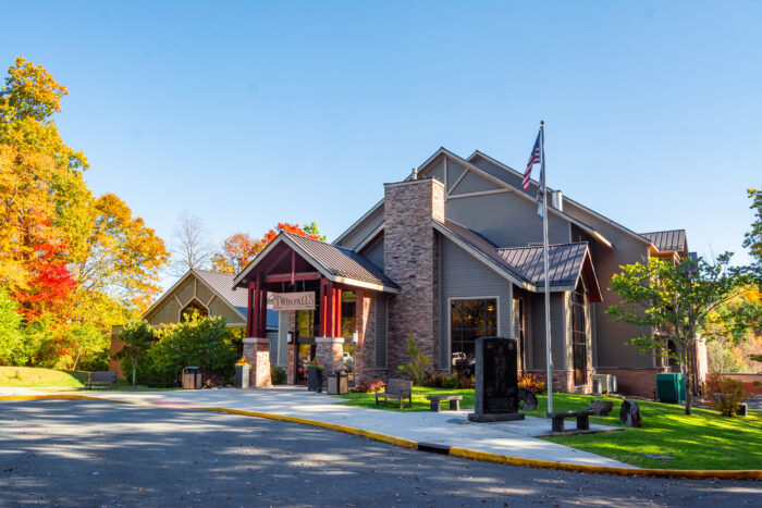 Front entrance of Twin Falls Resort State Park lodge at the beginning of fall leaves changing