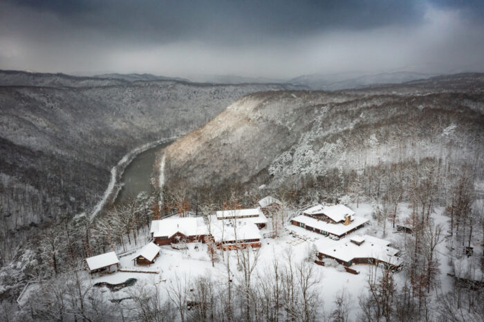 Overhead view of the Adventures on the Gorge resort. Snow has fallen and the New River is looking ice cold from this angle.
