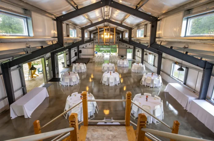 Inside the Confluence Event Center. Tables set up for an event in the large space. 