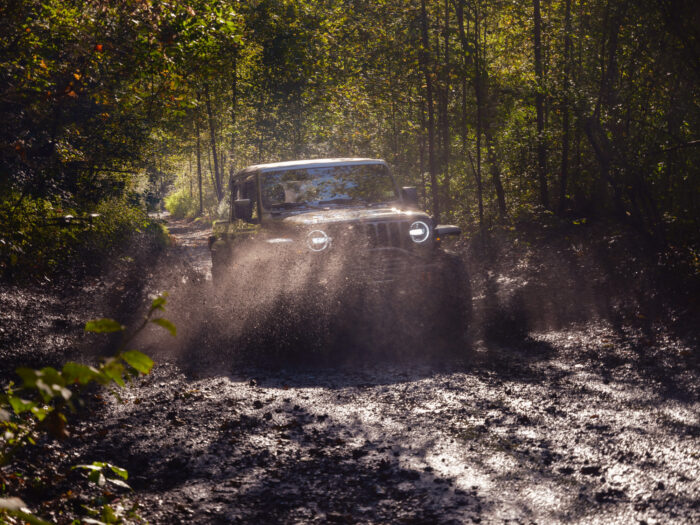 Jeep driving through mud